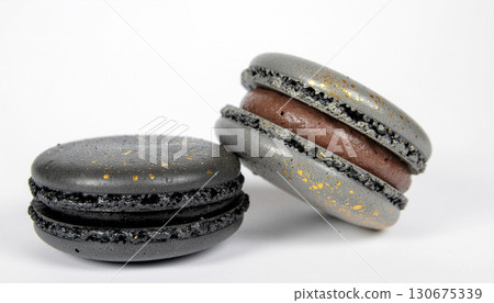 Luxury black macarons adorned with gold flakes - Generative AI 130675339
