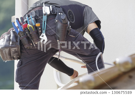 Workers working outdoors at height 130675589