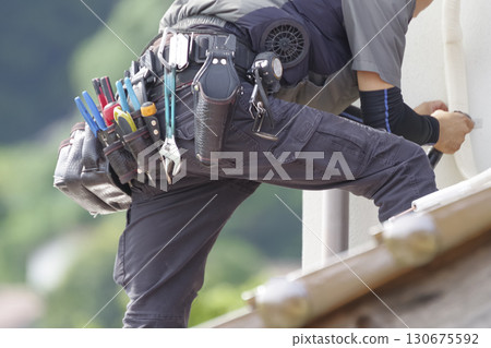 Workers working outdoors at height 130675592