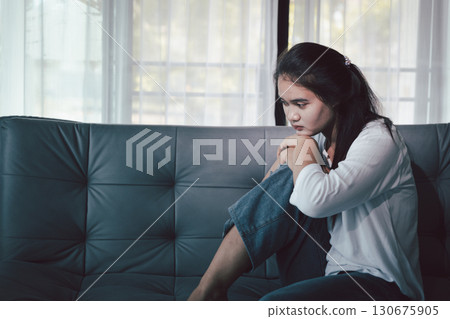 Depression woman sit on sofa. Despair sorrow person sitting alone and hugging knees, Boring sad upset frustrated stressed. struggling to find hope amid suffocating burden. mental health concept. Depression woman sit on sofa. Despair sorrow person sitting alone and hugging knees, Boring sad upset frustrated stressed. struggling to find hope amid suffocating burden. mental health concept. 130675905