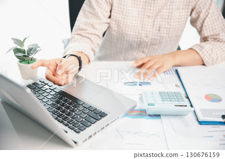 Businesswoman analysis with financial data, marketing business strategy project, Business financing accounting banking concept, finances, calculate about cost to real estate investment, tax system. 130676159