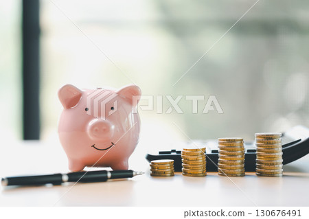 Money box filled with coins, saving cash, banking wisely, making sound investments can build financial wealth, personal finance and overall economy through proper business and currency management. Money box filled with coins, saving cash, banking wisely, making sound investments can build financial wealth, personal finance and overall economy through proper business and currency management. 130676491