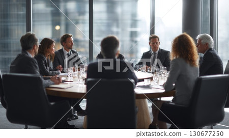 Business people having a meeting in modern office boardroom 130677250