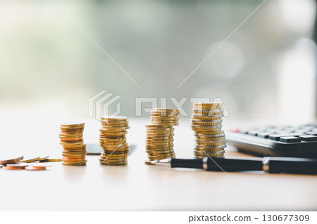 Finance and banking, saving coins, cash, gold while making smart investments in business, currency can build wealth, increase profit, achieve financial success that adds value to overall economy. Finance and banking, saving coins, cash, gold while making smart investments in business, currency can build wealth, increase profit, achieve financial success that adds value to overall economy. 130677309