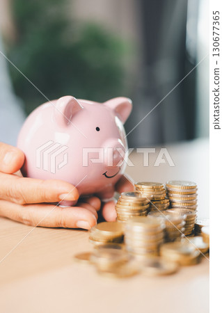 Hand holding coin symbolizes saving, investment, smart finance decisions money, currency, cash financial wealth, driving business growth, economic stability, long-term success in banking economy. Hand holding coin symbolizes saving, investment, smart finance decisions money, currency, cash financial wealth, driving business growth, economic stability, long-term success in banking economy. 130677365