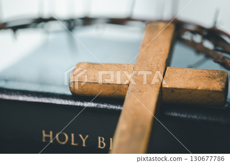 Crown of thorns and cross powerful symbols in Christianity, representing holy sacrifice of Jesus Christ in Bible and serving as enduring reminders of faith and core of Christian religion. 130677786