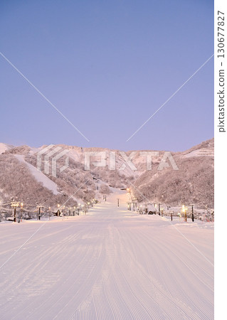 A beautiful ski resort illuminated by the morning sun 130677827