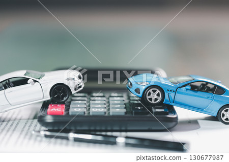 Client legal contract and finance document for business deal involving vehicle, agreements cover car loan, insurance, investment terms, with car key handed over to complete transaction. Client legal contract and finance document for business deal involving vehicle, agreements cover car loan, insurance, investment terms, with car key handed over to complete transaction. 130677987