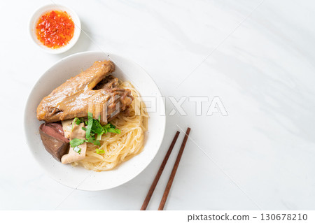 dried noodles with braised duck in white bowl 130678210