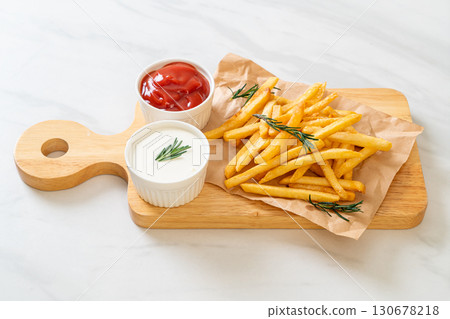 French fries with sour cream and ketchup French fries with sour cream and ketchup 130678218