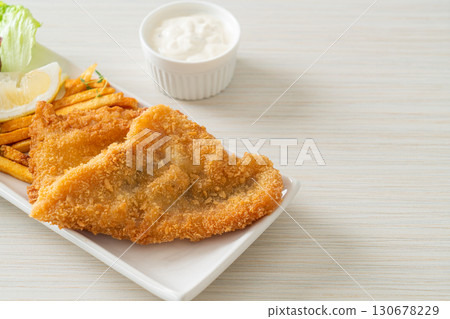 fish and chips - fried fish fillet with potatoes chips 130678229
