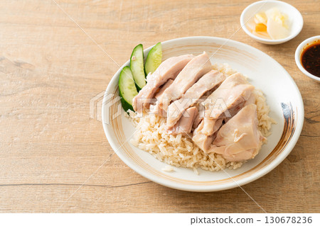Hainanese chicken rice or rice steamed with chicken soup Hainanese chicken rice or rice steamed with chicken soup 130678236