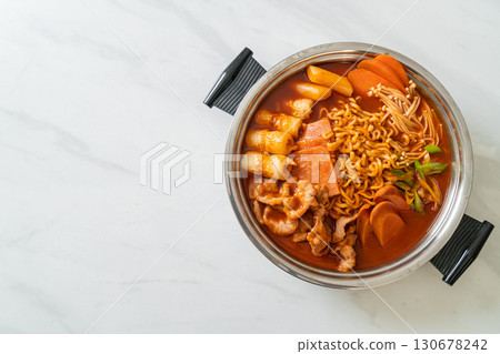 Budae Jjigae or Budaejjigae (Army stew or Army base stew). It is loaded with Kimchi, spam, sausages, ramen noodles and much more 130678242