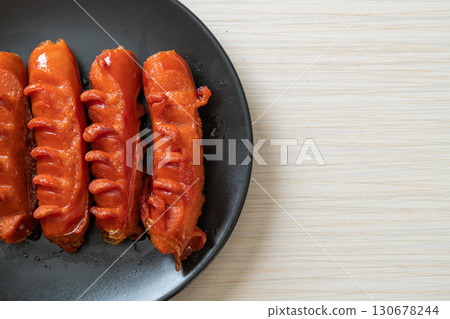 deep fried sausage skewer on plate deep fried sausage skewer on plate 130678244