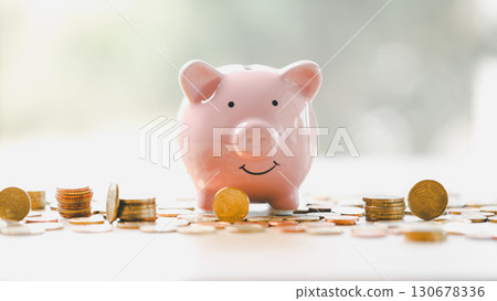 Money box filled with coins, saving cash, banking wisely, making sound investments can build financial wealth, personal finance and overall economy through proper business and currency management. Money box filled with coins, saving cash, banking wisely, making sound investments can build financial wealth, personal finance and overall economy through proper business and currency management. 130678336