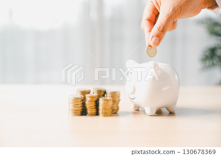 Businesswoman focused on saving money, smart financial planning, using banking, investment strategies to grow business, build wealth, achieve success while contributing to overall economy growth. Businesswoman focused on saving money, smart financial planning, using banking, investment strategies to grow business, build wealth, achieve success while contributing to overall economy growth. 130678369
