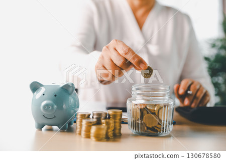 Hand holding coin symbolizes saving, investment, smart finance decisions money, currency, cash financial wealth, driving business growth, economic stability, long-term success in banking economy. Hand holding coin symbolizes saving, investment, smart finance decisions money, currency, cash financial wealth, driving business growth, economic stability, long-term success in banking economy. 130678580