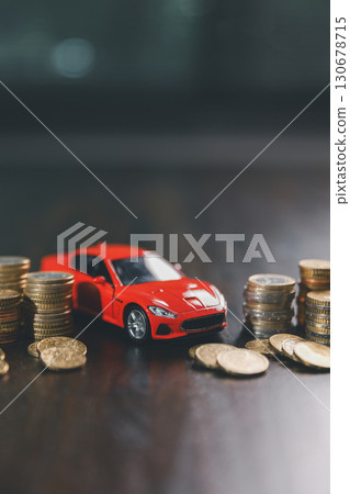Euro car finance. car with calculator and money on wood table. insurance concept. investment and wealth accumulation through the symbolism of miniature car alongside coins. Euro car finance. car with calculator and money on wood table. insurance concept. investment and wealth accumulation through the symbolism of miniature car alongside coins. 130678715