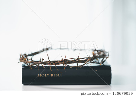 Crown of thorns is holy symbol in Christianity, representing sacrifice of Jesus Christ as described in Bible and serving as powerful reminder of faith, religion, spirituality and meaning of Easter. 130679039