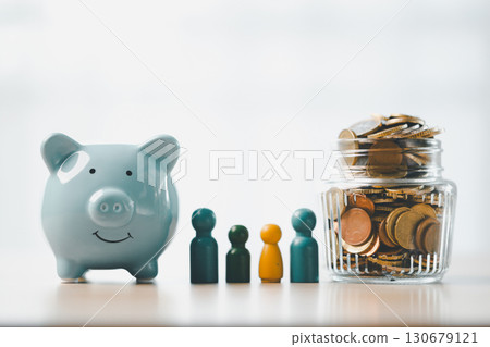 Money box filled with coins, saving cash, banking wisely, making sound investments can build financial wealth, personal finance and overall economy through proper business and currency management. Money box filled with coins, saving cash, banking wisely, making sound investments can build financial wealth, personal finance and overall economy through proper business and currency management. 130679121