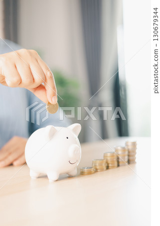 Hand holding coin symbolizes saving, investment, smart finance decisions money, currency, cash financial wealth, driving business growth, economic stability, long-term success in banking economy. Hand holding coin symbolizes saving, investment, smart finance decisions money, currency, cash financial wealth, driving business growth, economic stability, long-term success in banking economy. 130679344