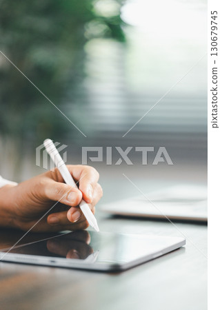 Finance bank tax expense accounting budget money businessman hand use calculator Financial calculate accountant close up calculator with graph chart write office desk Business expense analysis saving 130679745