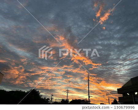 This is the sunrise and bright red clouds at around 4:30 in the morning in late June. 130679996
