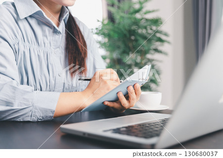 Business woman analyze calculate company financial, tax results office accounting statistics analytical research. calculating business balance prepare tax reduction. Tax deduction planning concept. 130680037