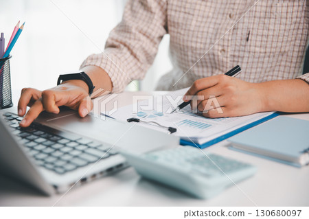 Businesswoman analysis with financial data, marketing business strategy project, Business financing accounting banking concept, finances, calculate about cost to real estate investment, tax system. Businesswoman analysis with financial data, marketing business strategy project, Business financing accounting banking concept, finances, calculate about cost to real estate investment, tax system. 130680097