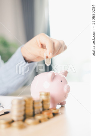 Hand holding coin symbolizes saving, investment, smart finance decisions money, currency, cash financial wealth, driving business growth, economic stability, long-term success in banking economy. 130680284