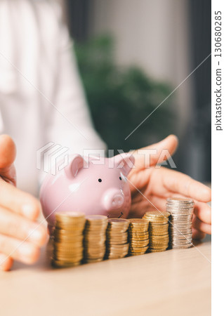 Hand holding coin symbolizes saving, investment, smart finance decisions money, currency, cash financial wealth, driving business growth, economic stability, long-term success in banking economy. Hand holding coin symbolizes saving, investment, smart finance decisions money, currency, cash financial wealth, driving business growth, economic stability, long-term success in banking economy. 130680285