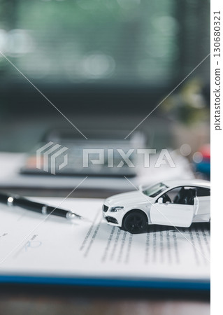 Car loan approval concept. Client finalizes purchase of vehicle by signing contract includes auto loan, insurance, credit terms, making car smart financial investment business-backed finance option. Car loan approval concept. Client finalizes purchase of vehicle by signing contract includes auto loan, insurance, credit terms, making car smart financial investment business-backed finance option. 130680321