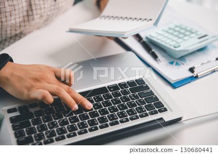 Businesswoman analysis with financial data, marketing business strategy project, Business financing accounting banking concept, finances, calculate about cost to real estate investment, tax system. 130680441
