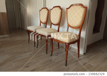Renewal of old vintage furniture. Chairs and white covers. Interior design in apartment. Renewal of old vintage furniture. Chairs and white covers. Interior design in apartment. 130682329