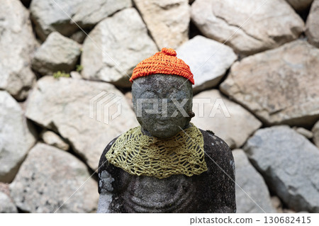 Jizo wearing a red hood 130682415