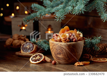Dried fruits and nuts on an old wooden table. 130682470