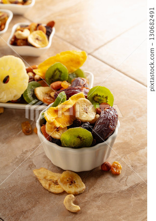 Dried tropical fruits with various nuts and raisins. 130682491