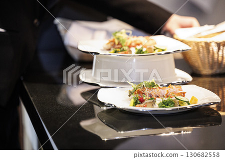 stock image of people working in a french kitchen 130682558