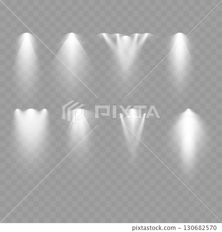 Set of realistic spotlight light effects on transparent background. Vector 130682570