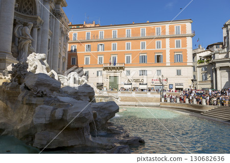 Rome, Italy - August 16, 2019: Tourists visiting the largest Trevi Fountain in Rome. Rome, Italy - August 16, 2019: Tourists visiting the largest Trevi Fountain in Rome. 130682636