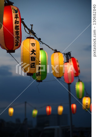 A photo of many hanging lanterns, dimly lit 130682840