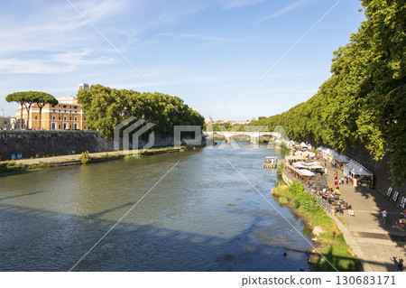 Rome, Italy - August 16, 2019: View of the bridge and the Tiber River in Rome Rome, Italy - August 16, 2019: View of the bridge and the Tiber River in Rome 130683171