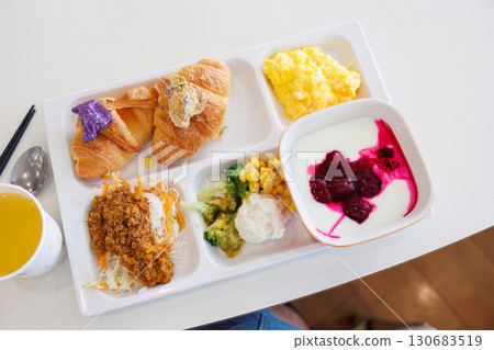 Breakfast buffet. Okinawa's specialty bitter melon chanpuru, carrot stir-fry, etc. Croissants are topped with Okinawa's specialty purple sweet potato and brown sugar. Breakfast buffet. Okinawa's specialty bitter melon chanpuru, carrot stir-fry, etc. Croissants are topped with Okinawa's specialty purple sweet potato and brown sugar. 130683519