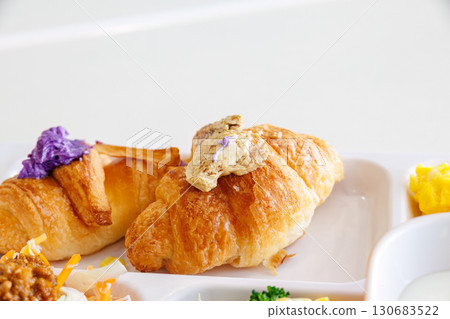 Breakfast buffet. Okinawa's specialty bitter melon chanpuru, carrot stir-fry, etc. Croissants are topped with Okinawa's specialty purple sweet potato and brown sugar. Breakfast buffet. Okinawa's specialty bitter melon chanpuru, carrot stir-fry, etc. Croissants are topped with Okinawa's specialty purple sweet potato and brown sugar. 130683522