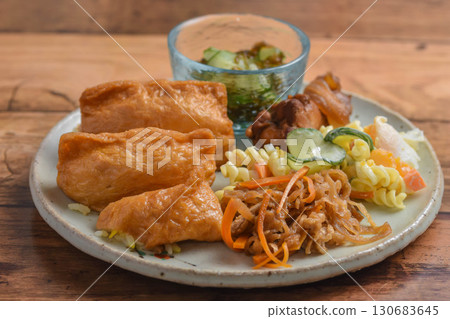 Inari sushi on a plate Inari sushi on a plate 130683645