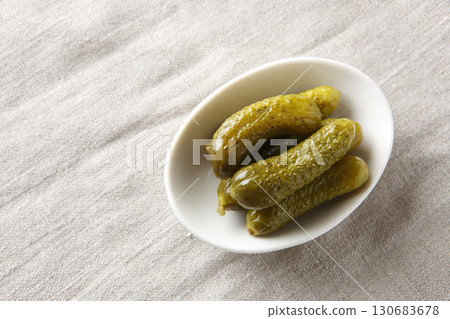 Pickled cucumbers in a white bowl Pickled cucumbers in a white bowl 130683678