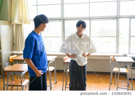 Male students practicing dance in a school classroom. Image of youth and school life. 130683691