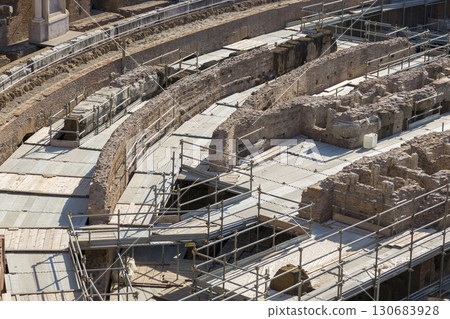 Rome, Italy - August 17, 2019: Building structures for the restoration of the Coliseum Rome, Italy - August 17, 2019: Building structures for the restoration of the Coliseum 130683928