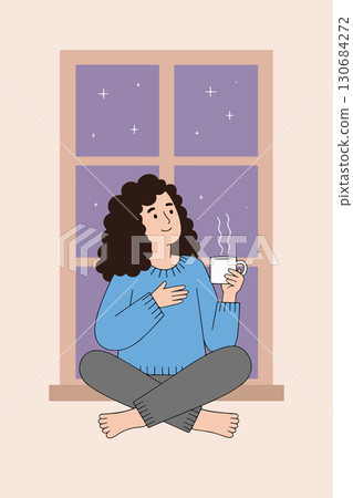 Woman enjoying coffee by the window at night Woman enjoying coffee by the window at night 130684272