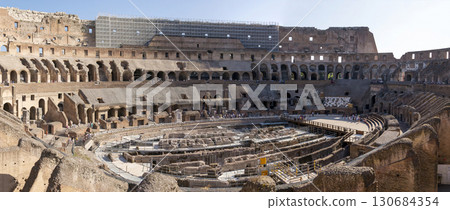 Rome, Italy - August 17, 2019: Colosseum - amphitheater, a monument of architecture of Ancient Rome, inside view. 130684354
